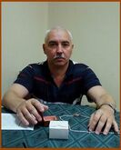 ...Юрий Борисович Шелаев, учредитель и бес(сменный) директор издательства «Лики России» в своём кабинете в момент вручения ему Ордена Слабости №5 (первой степени)...